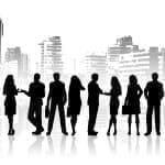 Silhouettes of business people against grunge city background