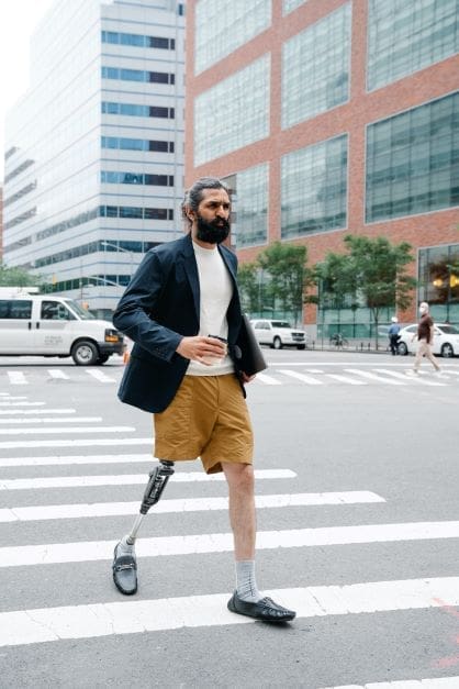 Medical Disability Rate VS. Degree of Incapacity - man with a prosthetic leg crossing street