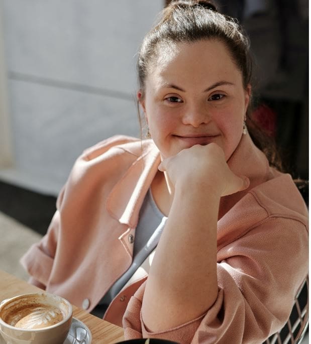 Disability Rights in Israel - woman with down syndrome enjoying a coffee