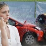 woman using phone after car crash auto accident lawyer in Israel